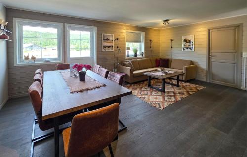 a living room with a table and a couch at Gorgeous Apartment In Drangedal in Drangedal