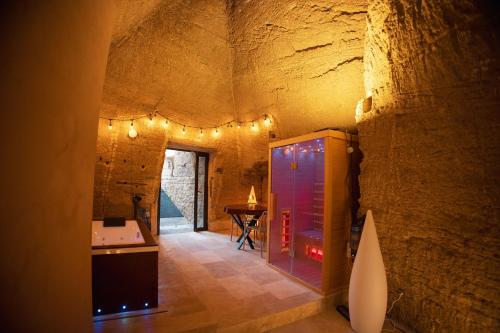 a wine tasting room in an old stone building at L'Escapade in Baugé