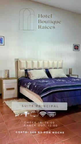 a bedroom with a bed and a hotel furniture rates sign at Raices Boulevard Hotel in Portachuelo