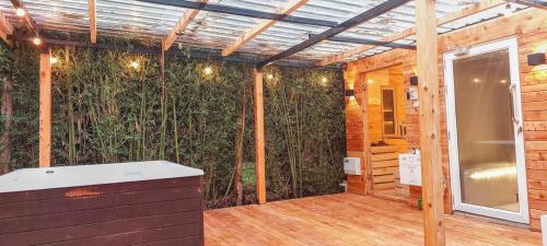 an outdoor room with a wall of plants at Barnhouse Cottage - Sauna & Steam bath - in Tigoni in Nairobi