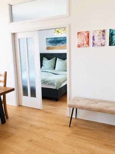 a bedroom with a mirror and a bed in a room at Troisdorf - City - 64Qm - 1 bis 3 Schlafplätze in Troisdorf