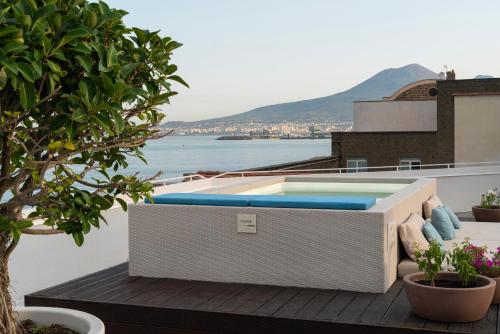 a swimming pool on the roof of a building at La Chiaja art&relais in Castellammare di Stabia