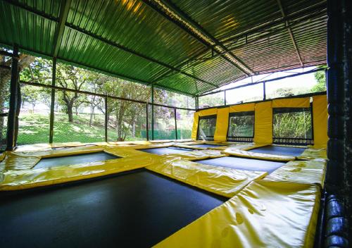 an inside view of a tent with beds in it at Itapura Eco Resort in Atibaia