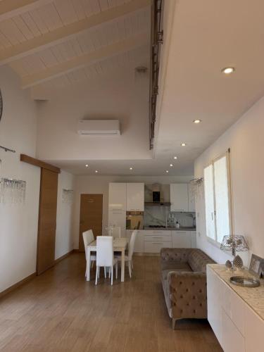 a living room with a couch and a table at Villa Forni in Cesenatico