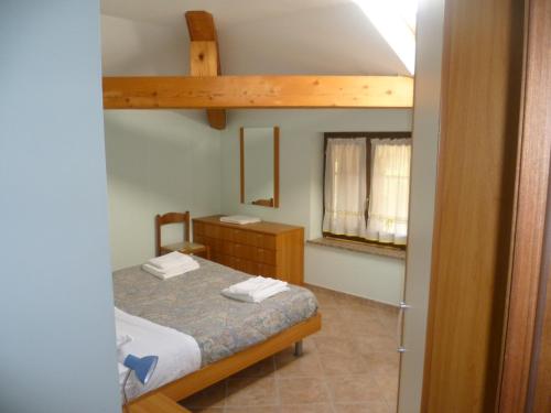 Tempat tidur dalam kamar di Casa Vacanza Ca dei Logi