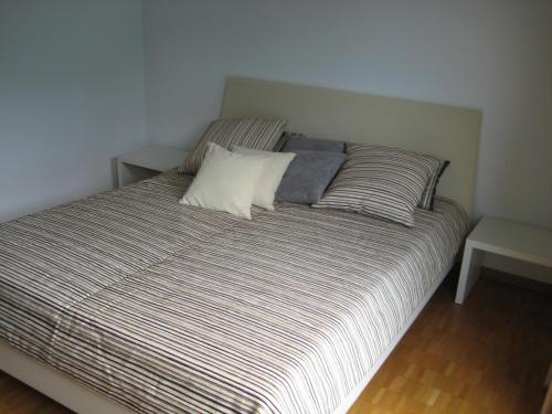 a bed with two pillows on it in a room at Ferienhaus Stemer Montafon in Schruns