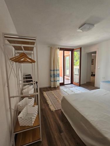 a bedroom with a bunk bed and a ladder at Casa natura in Usini
