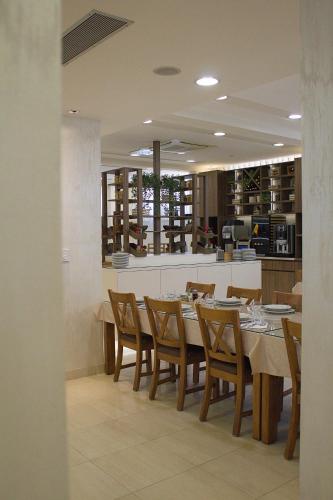a dining room with a table and chairs at Hotel Luna in Međugorje