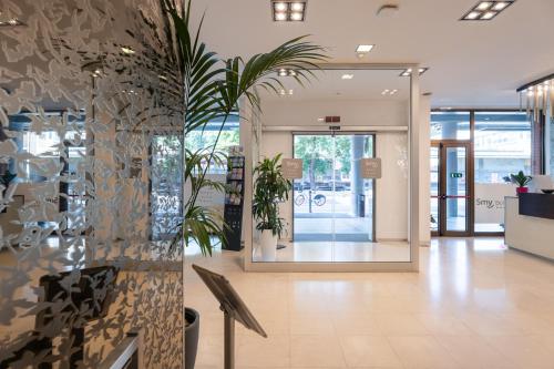 a lobby of a store with a glass wall at Smy Bologna Centrale in Bologna