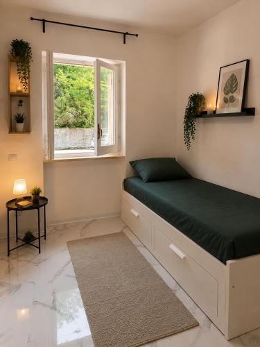 a bedroom with a bed and a window at Leonardo Loft in Filettino