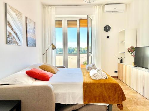 a bedroom with a bed with towels on it at Bellavista Apartment Arcore in Arcore