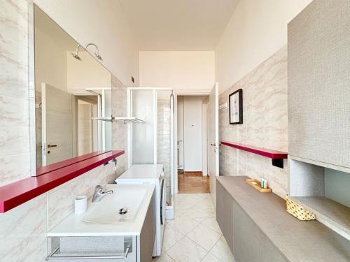 a bathroom with two sinks and a large mirror at Bellavista Apartment Arcore in Arcore