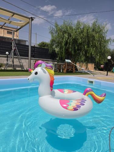 a unicorn float in a swimming pool at Villa Marusia in Tollo