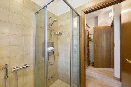 a shower with a glass door in a bathroom at Casa Antony in Torri del Benaco