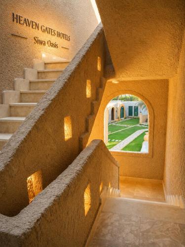 an entrance to a building with stairs and a window at Heaven Gates Hotel in Siwa