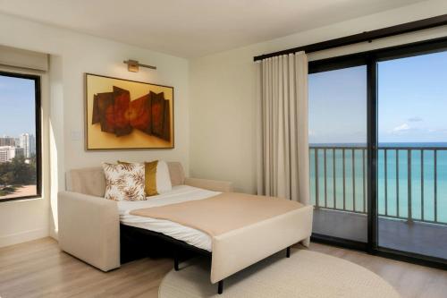 a bedroom with a bed with a view of the ocean at Marriott Isla Verde Beach Resort in Carolina