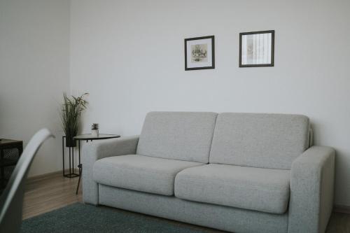 a living room with a couch and a table at Hotel Central Vlašić in Vlasic