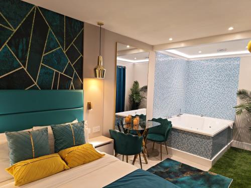 a bedroom with a bathroom with a tub and a bed at Seven Paddington in London