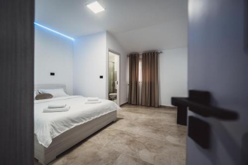 a bedroom with a bed and a desk in it at Alpine Retreat in Borsa