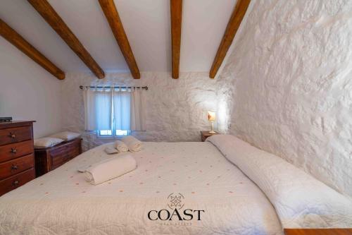 a bedroom with a large bed in a room at San Pantaleo Charme in San Pantaleo