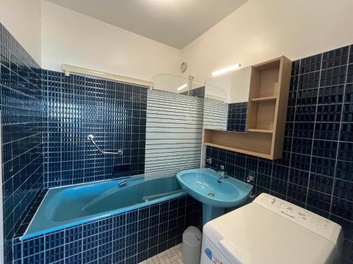 Appartement T2 RDC avec Jardinet et Accès Direct Plage, Parking Sécurisé, Proche Commerces