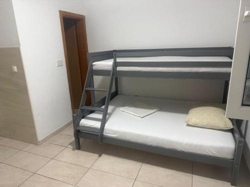a room with two bunk beds in a room at Studio Apartment Sanja 2 in Neum
