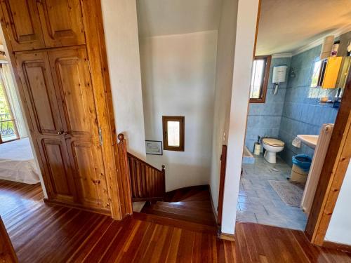 a bathroom with a sink and a toilet in a room at Zeba apartment 200m from the Sea in Dhílesi