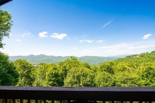 a view of the mountains from the balcony of a house at Grey Fox in Banner Elk