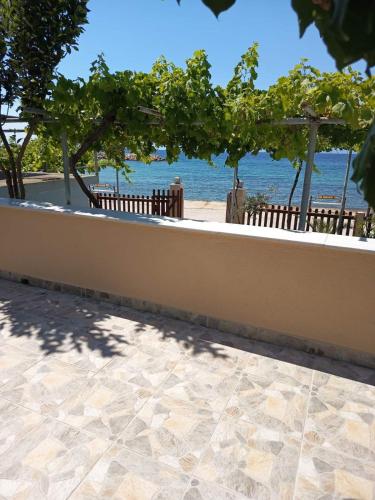 a wall with a view of the ocean at Antonia's house on the beach in Skala Sotiros