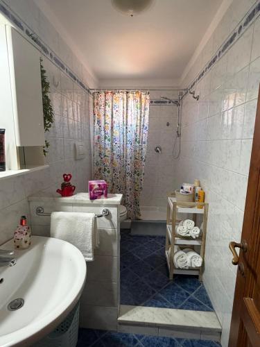 a bathroom with a tub and a sink and a shower at Del Rio Palace Guest House in Certaldo
