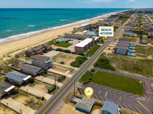an aerial view of a resort near the beach at 5065 - Flip Flop Inn in Kill Devil Hills