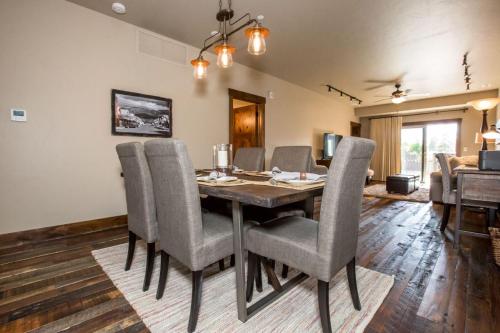 a dining room with a table and chairs at Baker Loft 203 in Whitefish