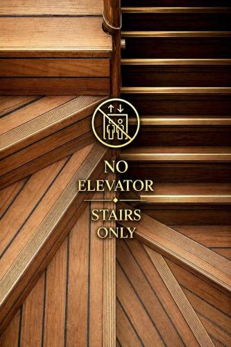 a no elevator stairs only sign on a wooden door at Boutique Hotel Miramar in Monte Carlo