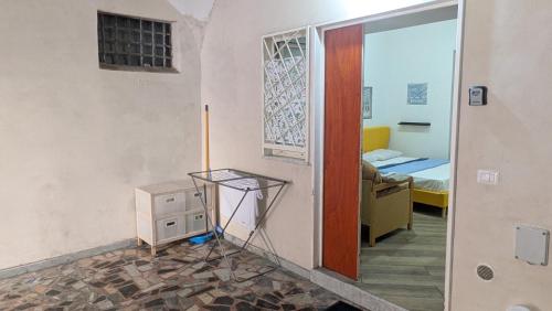 a room with a door and a room with a bed at Mare oltre in Castellammare di Stabia
