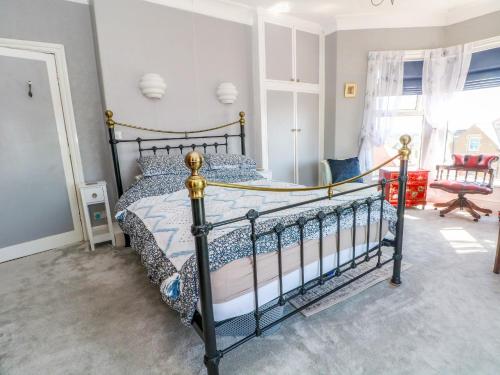 a bedroom with a black bed in a room at Ferncliffe in Morecambe