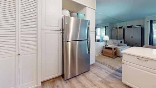 a kitchen with a stainless steel refrigerator in a room at Elkhorn Village Studio 2026 in Sun Valley