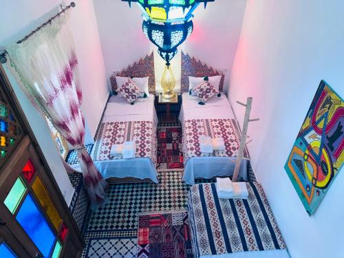 an overhead view of a room with two beds at Riad Rita in Meknès