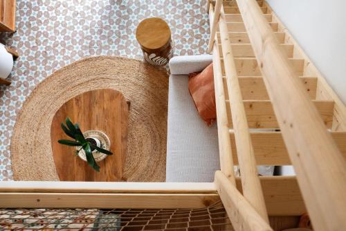 a doll house with a spiral staircase in a room at Horizon Carcassonne in Carcassonne