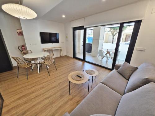 a living room with a couch and a table at BR Silgar Club in Sanxenxo