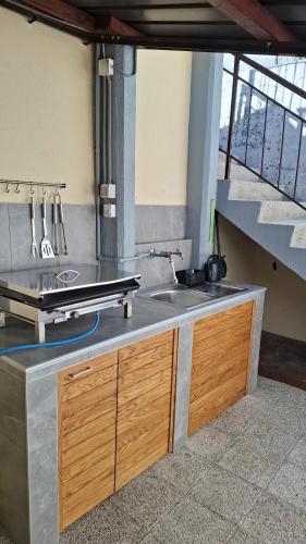 a kitchen with a sink and a counter top at Apartma Center in Bovec