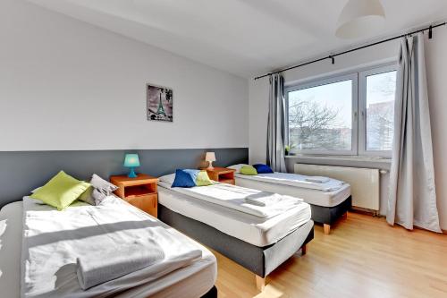 Кровать или кровати в номере Nice Rooms - Pokoje Gościnne