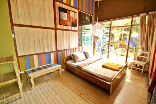 Кровать или кровати в номере Yambi Guesthouse