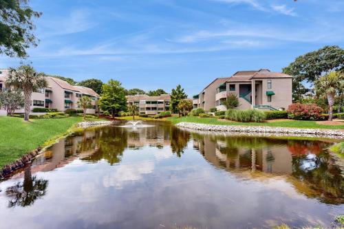 a river in a residential neighborhood with houses at Anchorage 7473 in Hilton Head Island