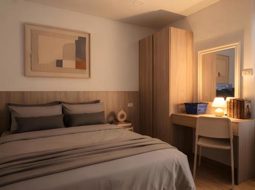 a bedroom with a bed and a desk and a window at Zen Cove Villa - 5-Min Walk to Zen Beach, Srithanu in Haad Chao Phao