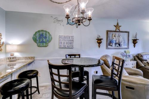 a dining room with a table and chairs at Fiddlers Cove 18B in Hilton Head Island