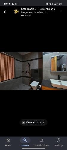 a bathroom with a sink and a toilet at Hotel Royal EdelWeiss in Leh