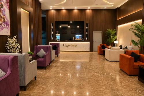 a lobby with couches and a counter in a store at فندق فصل الصيف امان - المنسك in Abha