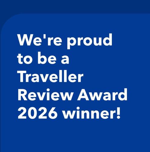 a blue text saying were proud to be a traveller review award winner at 25 Lillies in Rustenburg