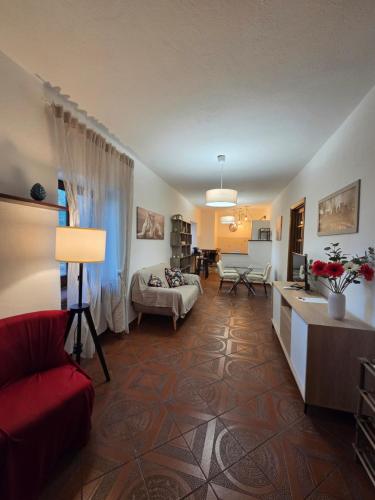 a large living room with a red couch and a living room at Il Casaletto di Simeone in Amelia