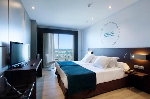 a hotel room with a bed and a television at Hotel Costa Azul in Palma de Mallorca